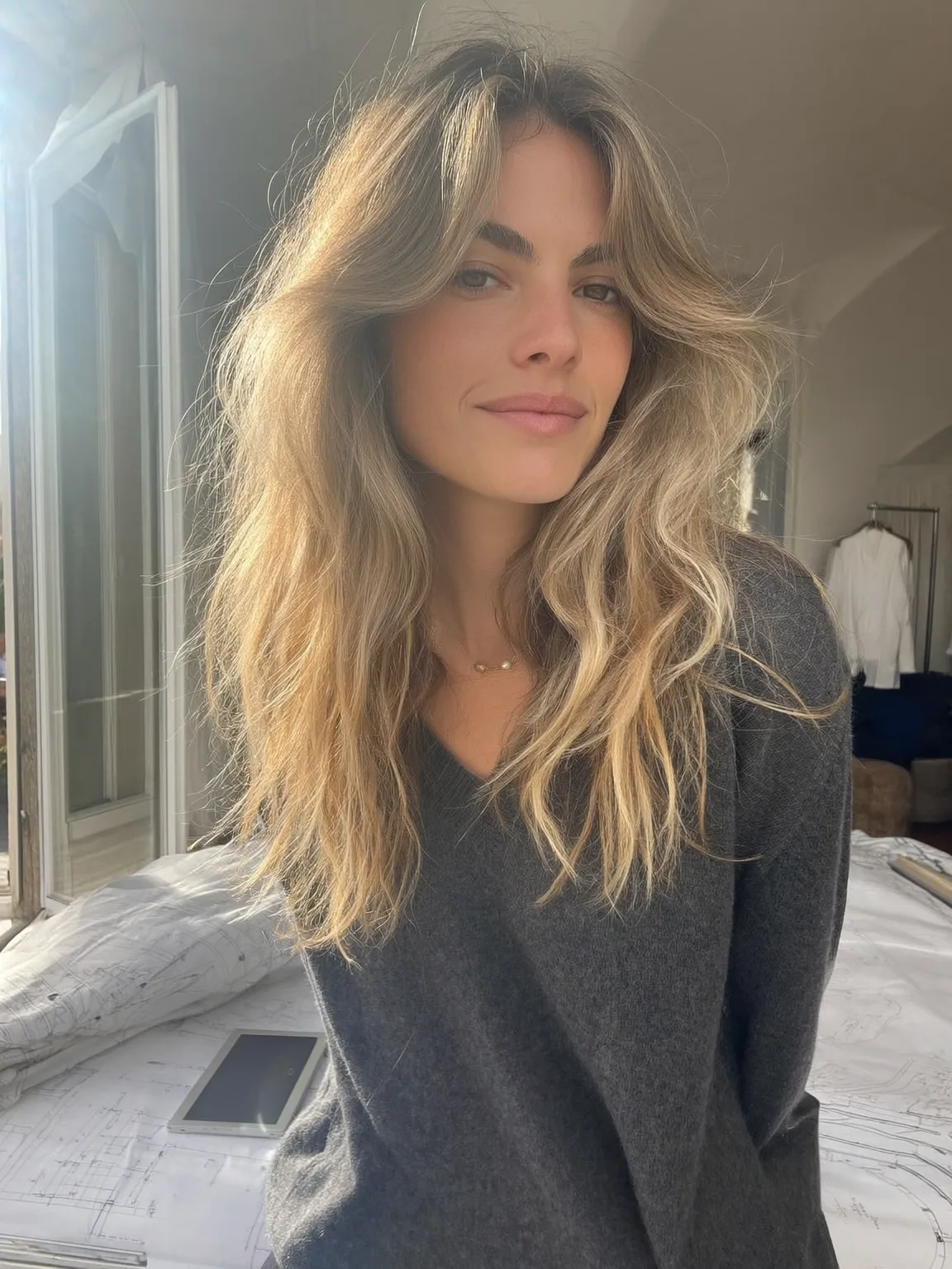 Voluminous Long Layers with Sun-Kissed Curtain Bangs